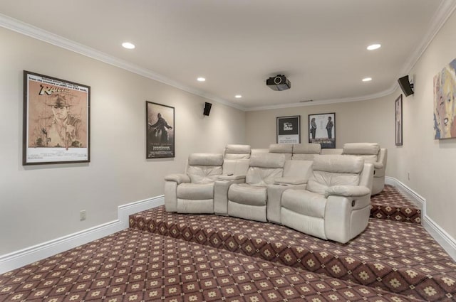 carpeted home theater room featuring crown molding