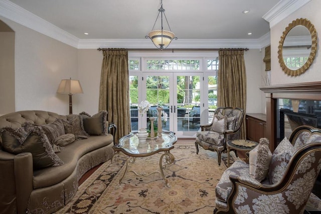 living room with french doors and crown molding