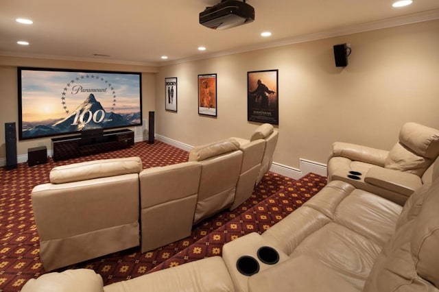 carpeted home theater room featuring crown molding