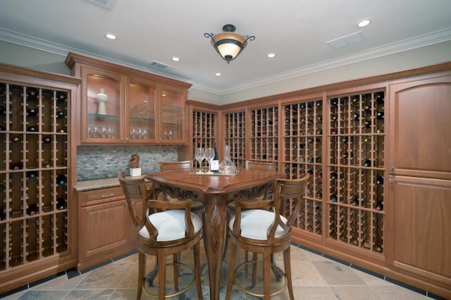 wine cellar featuring ornamental molding