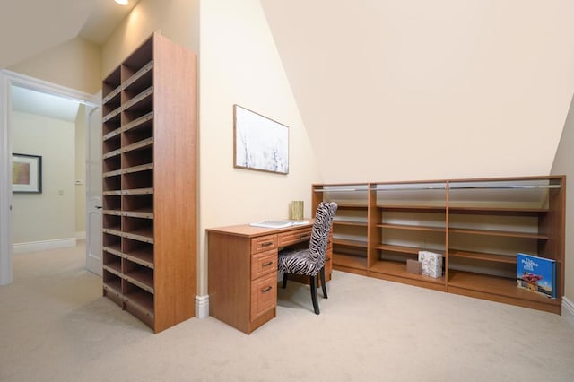 office featuring lofted ceiling and light colored carpet