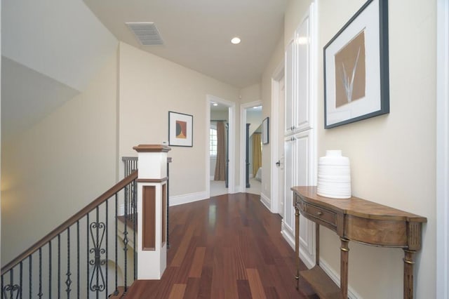 hallway with dark hardwood / wood-style floors