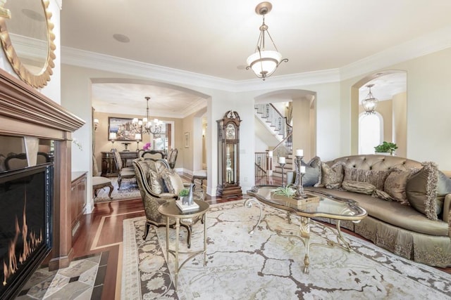 living room with crown molding, a healthy amount of sunlight, and dark hardwood / wood-style flooring