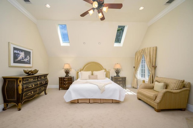 bedroom featuring crown molding, vaulted ceiling with skylight, carpet flooring, and ceiling fan