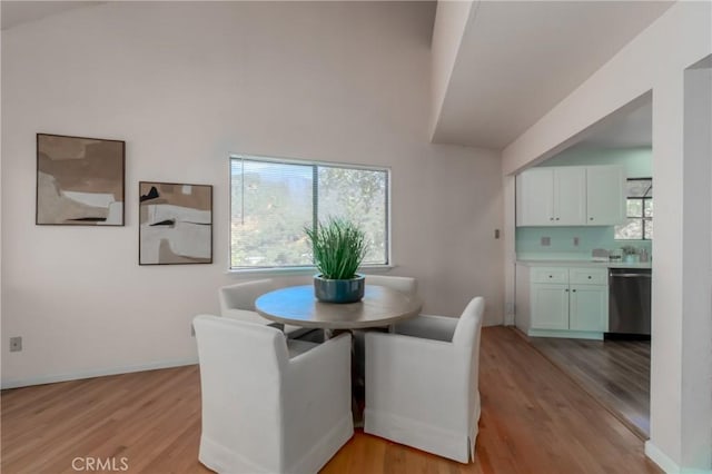 dining area with light hardwood / wood-style floors