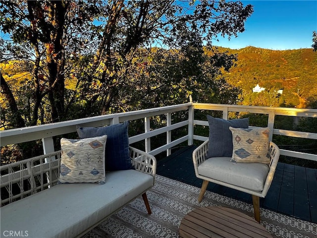 wooden terrace featuring a mountain view