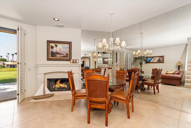 dining area with an inviting chandelier and light tile patterned floors