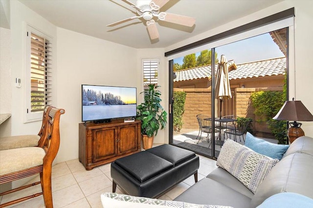 living room with ceiling fan and light tile patterned flooring