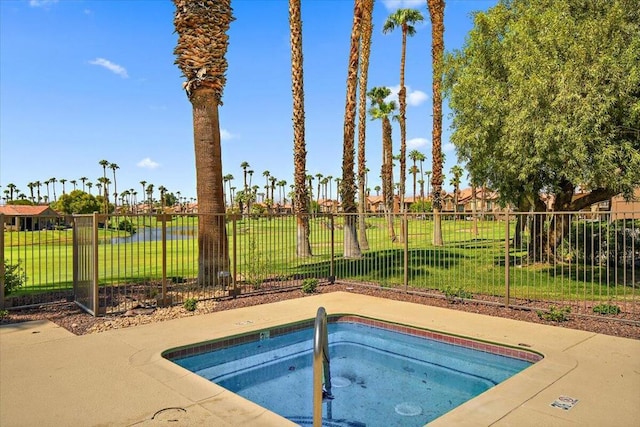 view of swimming pool featuring a yard