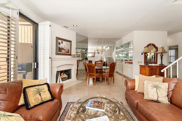 living room featuring an inviting chandelier and light tile patterned floors