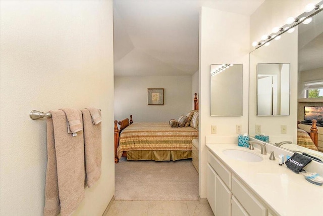 bathroom with tile patterned floors and vanity