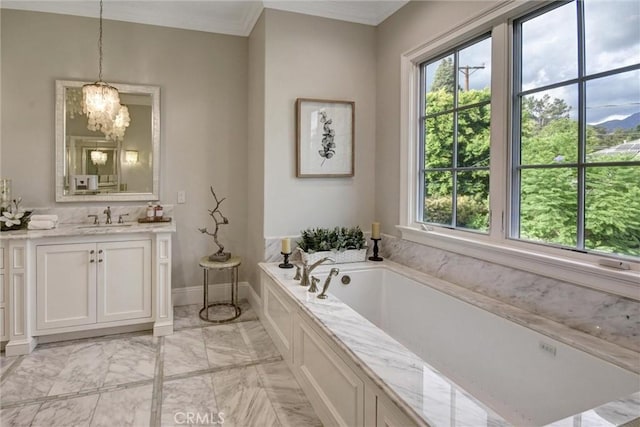 bathroom with vanity, crown molding, a bath, and an inviting chandelier