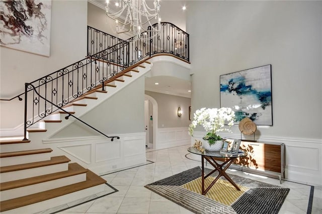 entrance foyer with a chandelier and a high ceiling