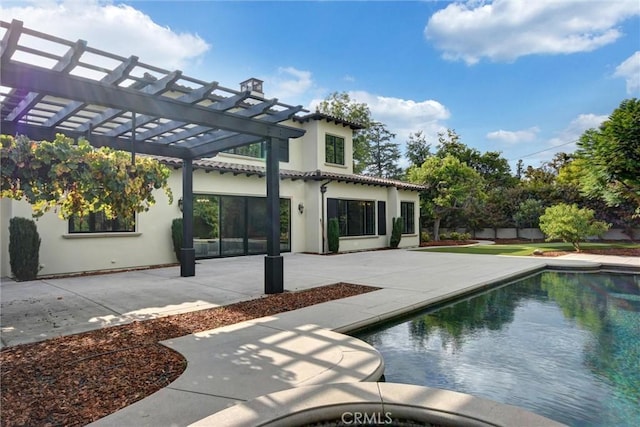 view of swimming pool with a pergola and a patio area