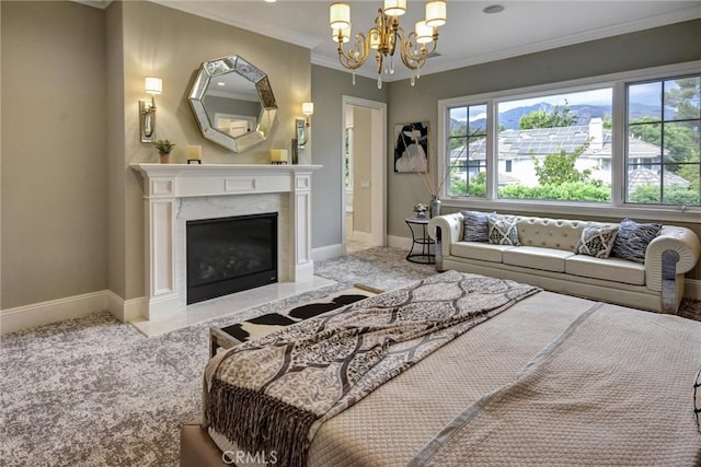 carpeted bedroom featuring a premium fireplace, ornamental molding, and a chandelier