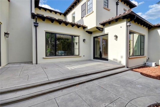 rear view of house with a patio