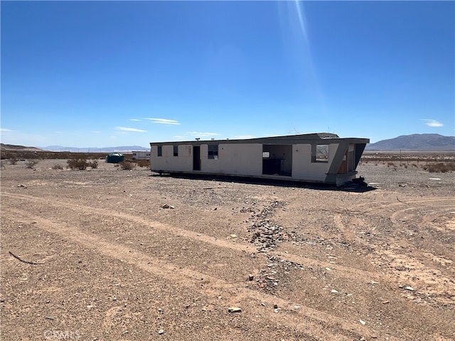 rear view of property with a mountain view