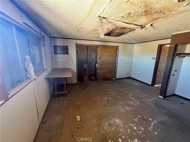 basement featuring a textured ceiling