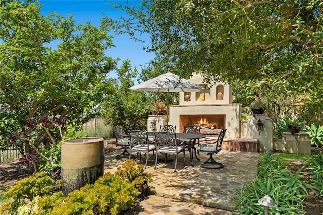 view of patio / terrace with a tile fireplace