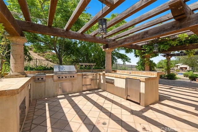 view of patio / terrace featuring area for grilling, grilling area, and a pergola