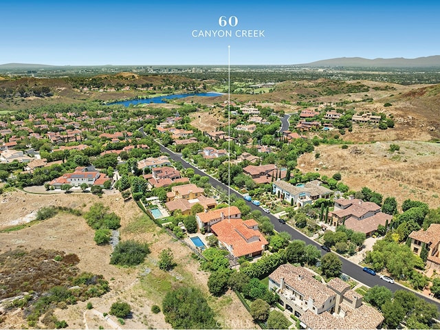 bird's eye view with a water and mountain view