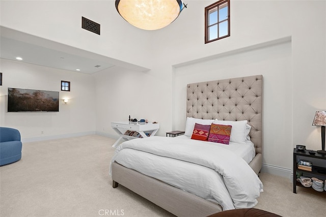 bedroom featuring light colored carpet