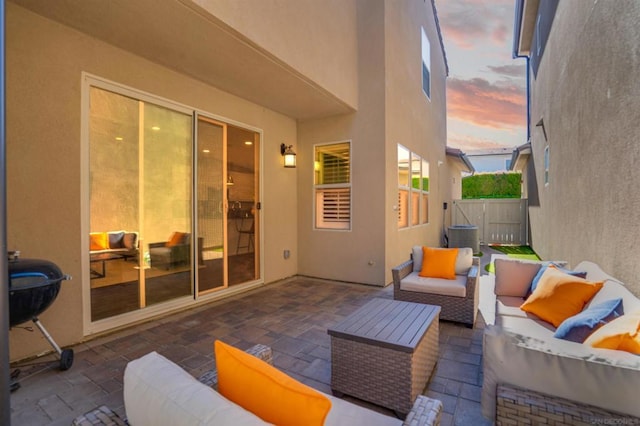 patio terrace at dusk with an outdoor hangout area