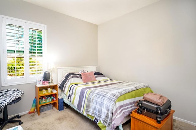 bedroom featuring light carpet