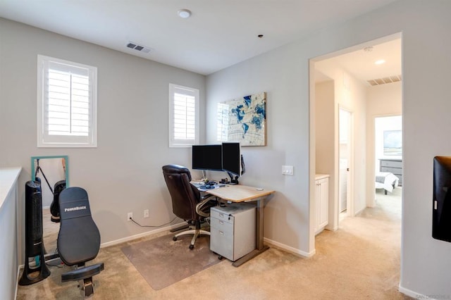 office area with light colored carpet