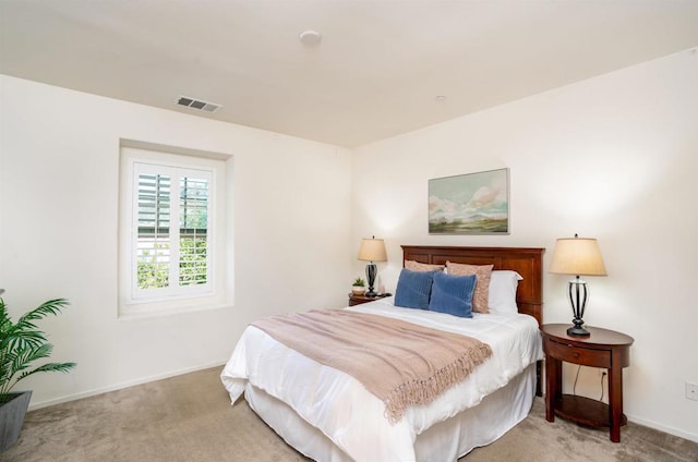 bedroom featuring light colored carpet