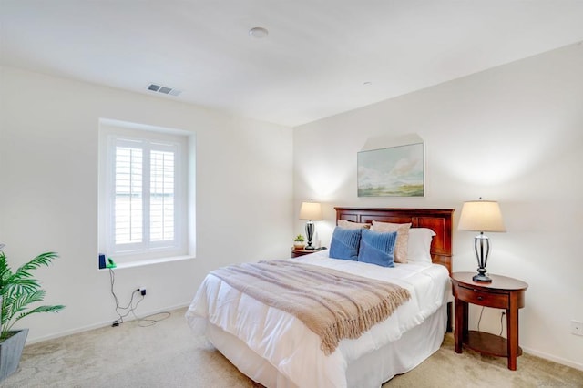 bedroom with light colored carpet