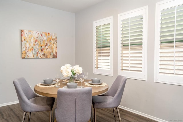 dining space featuring dark hardwood / wood-style flooring