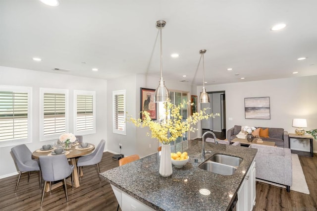 kitchen with white cabinetry, a healthy amount of sunlight, and sink