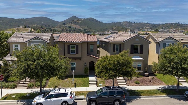 view of front of home featuring a mountain view