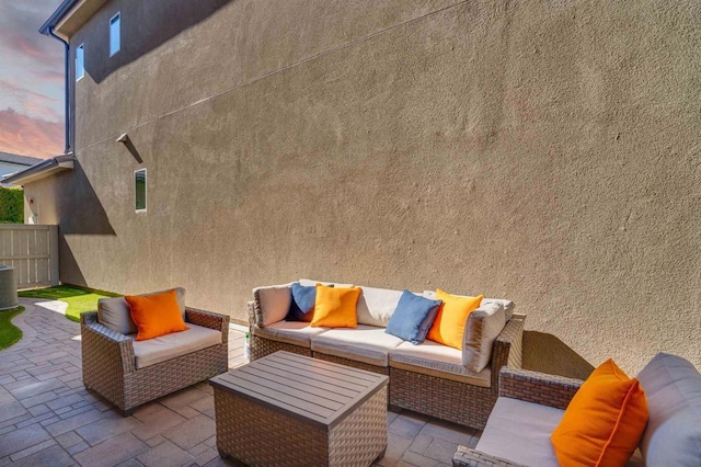 patio terrace at dusk with an outdoor living space