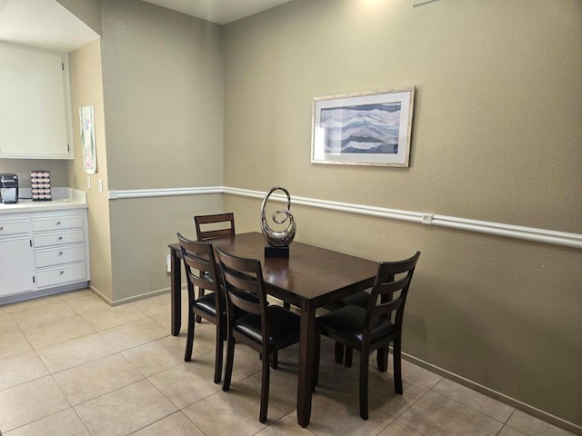 dining space with light tile patterned floors