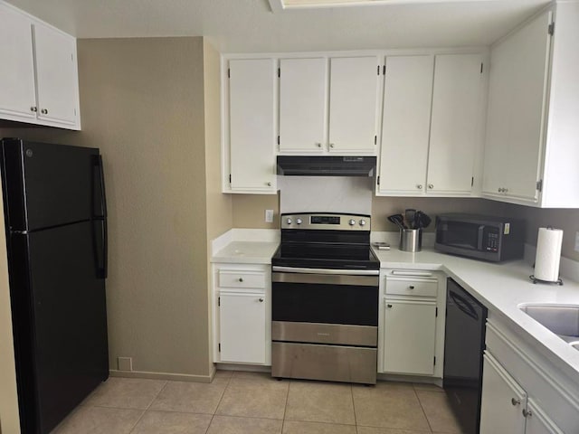 kitchen featuring black appliances, light tile patterned floors, and white cabinets