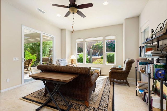 living room featuring ceiling fan and light tile patterned floors