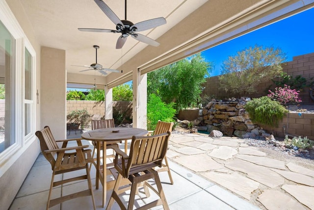 view of patio featuring ceiling fan