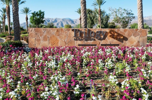 community sign with a mountain view