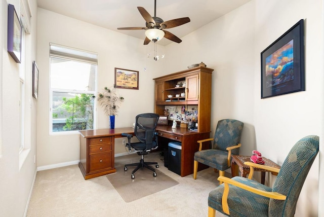 office space with ceiling fan and light carpet