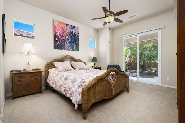 carpeted bedroom with ceiling fan and access to outside