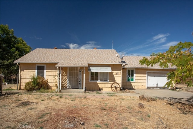 ranch-style home featuring a garage