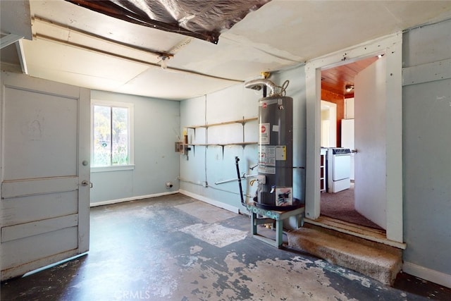 garage featuring gas water heater and washer / clothes dryer