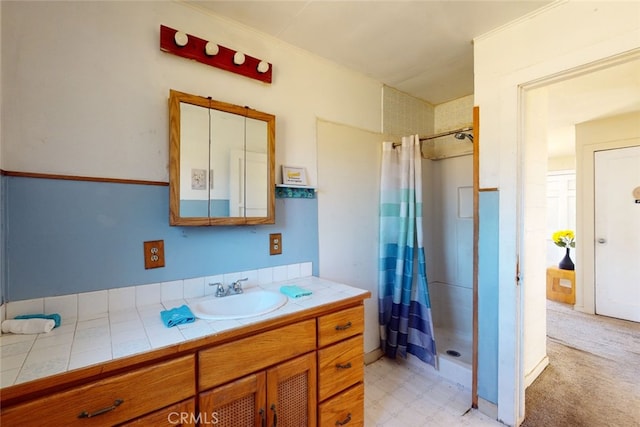 bathroom featuring a shower with curtain and vanity