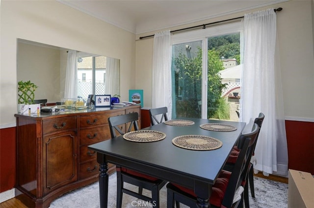 dining space with light wood-type flooring