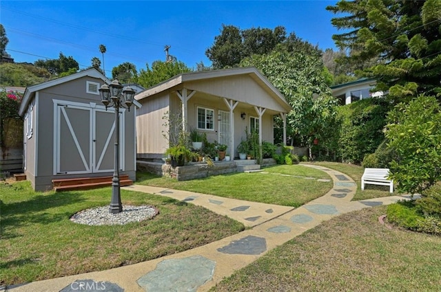 view of front facade with a storage unit and a front lawn