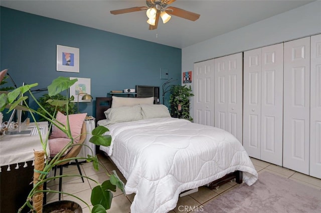 bedroom featuring ceiling fan and light tile patterned flooring