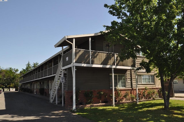 view of home's exterior with a lawn