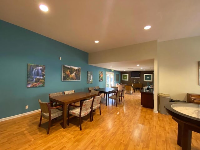 dining area with light hardwood / wood-style flooring